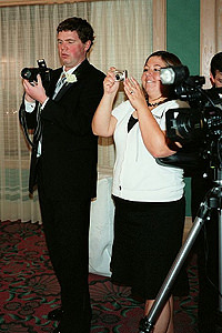 Nicely dressed wedding Paparazzi.